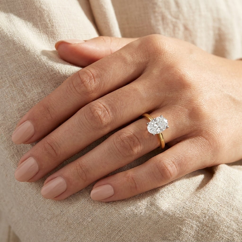SOL-050O-0LD Oval solitaire engagement ring hand-model