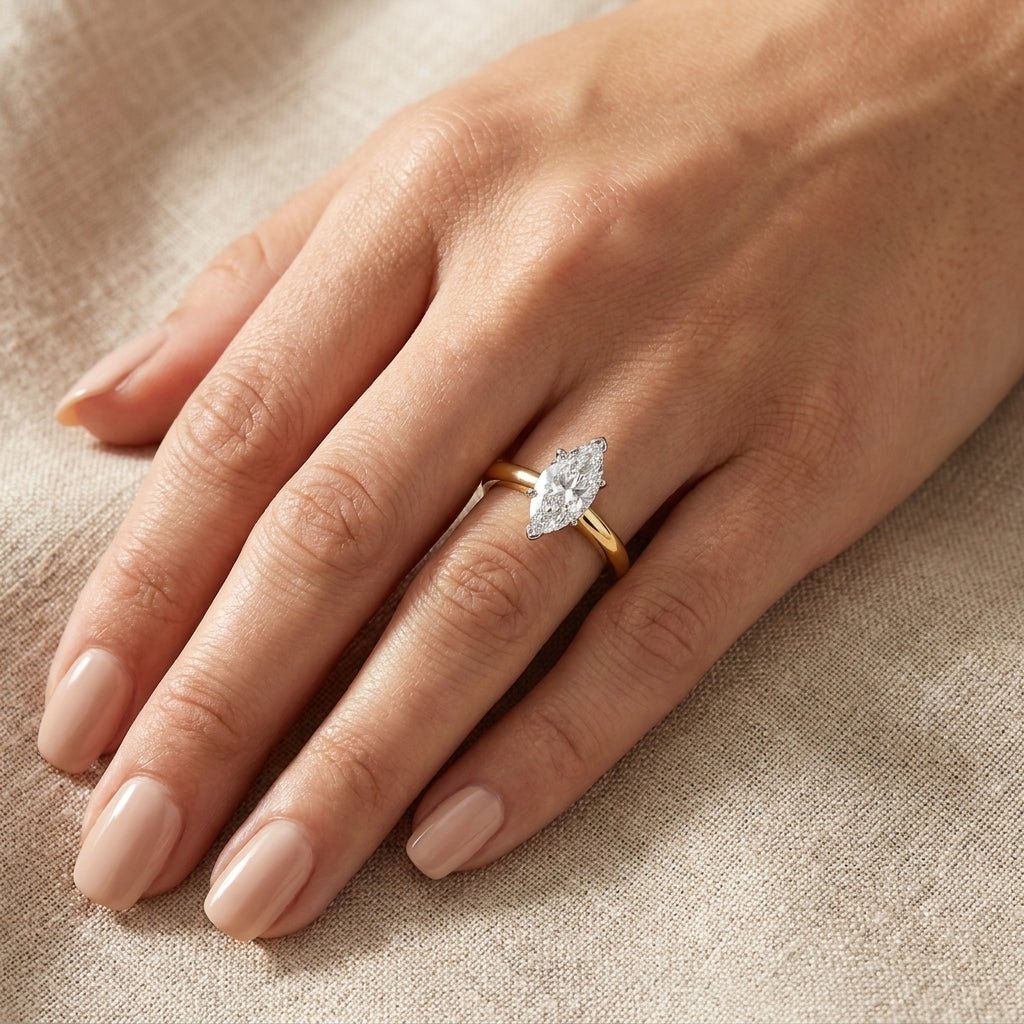 SOL-100MQ-0LD Marquise solitaire engagement ring hand-model