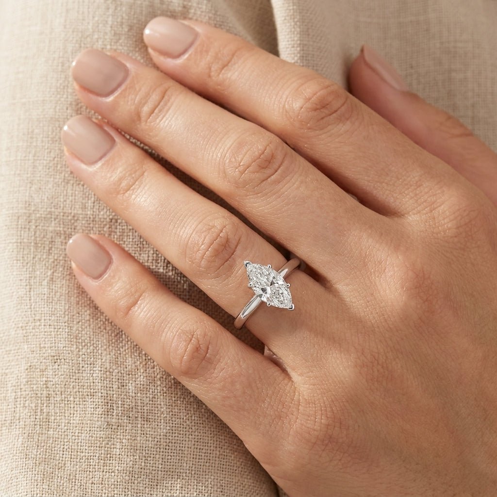 SOL-100MQ-0WLD Marquise solitaire engagement ring hand-model