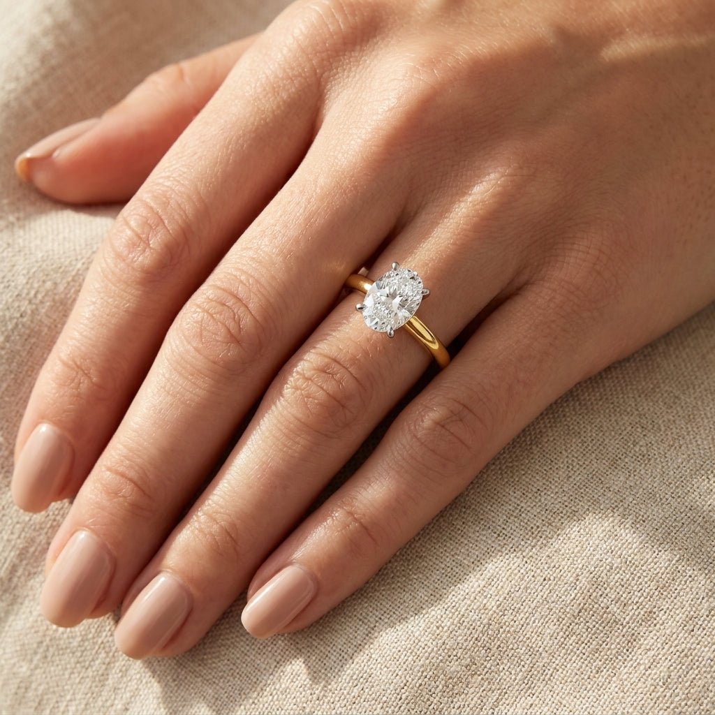 SOL-100O-0LD Oval solitaire engagement ring hand-model