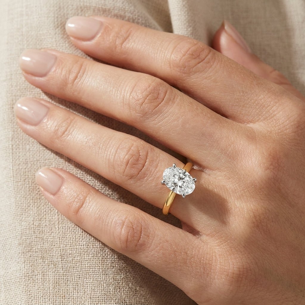 SOL-250O-0LD Oval solitaire engagement ring hand-model
