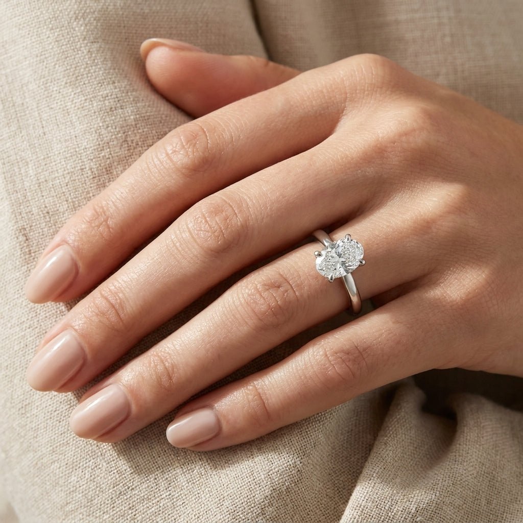 SOL-200O-0WLD Oval solitaire engagement ring hand-model
