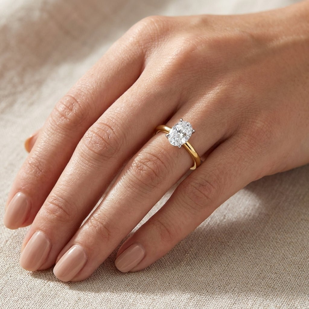 RM12599C-LD Oval solitaire engagement ring hand-model