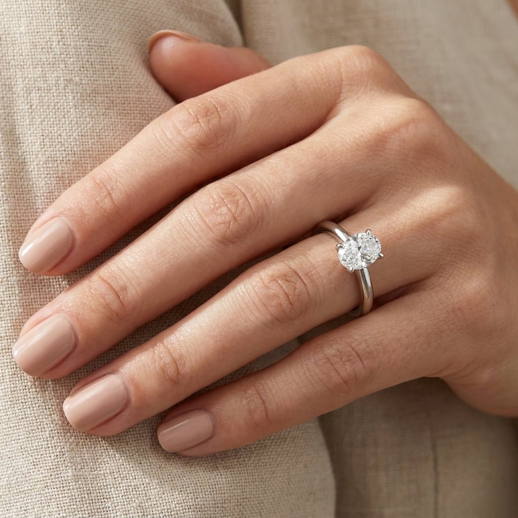 RM12599C-WLD Oval solitaire engagement ring hand-model