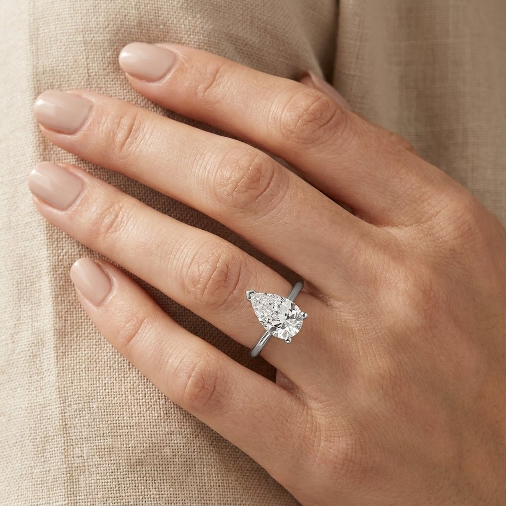 SOL-250PE-0WLD Pear solitaire engagement ring hand-model