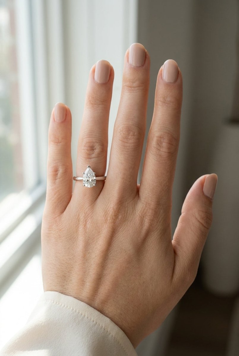 1 carat pear lab grown diamond engagement ring - full hand scale