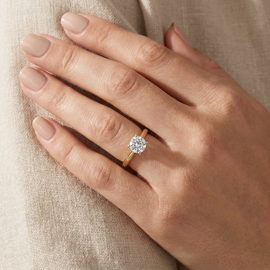 RM12596C-LD Round solitaire engagement ring hand-model