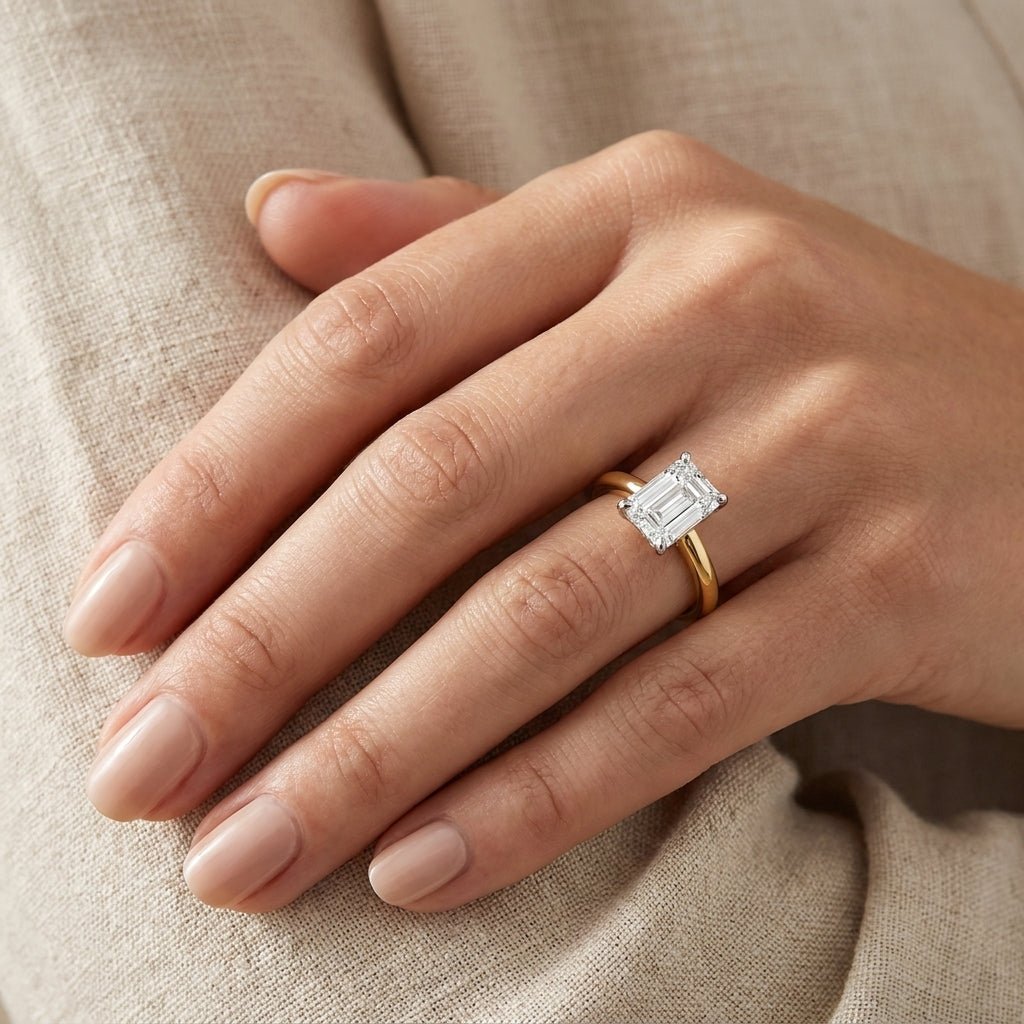 SOL-150EM-0LD Emerald solitaire engagement ring hand-model