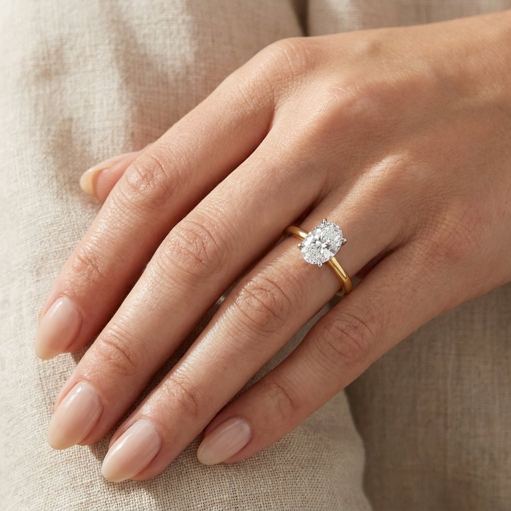 SOL-150O-0LD Oval solitaire engagement ring hand-model