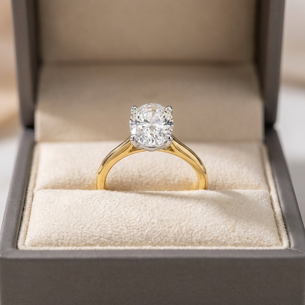 RM12600C-LD oval engagement ring in presentation box