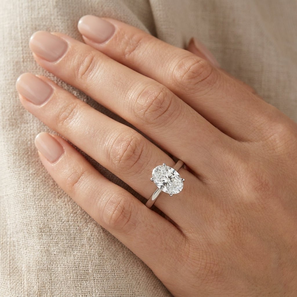RM12600C-WLD Oval solitaire engagement ring hand-model
