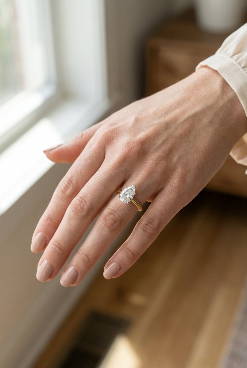 1.5 carat pear lab grown diamond engagement ring - full hand scale