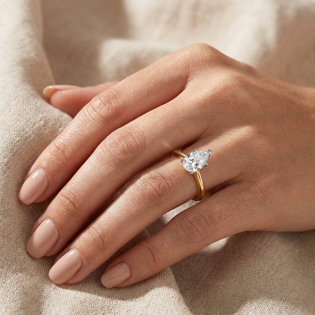 1.5 carat pear lab grown diamond engagement ring - hand model