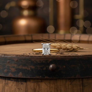Aydins 1.5 Carat Radiant Lab Grown Diamond Engagement Ring | 10K Two-Tone Gold lifestyle scene, whiskey barrel top