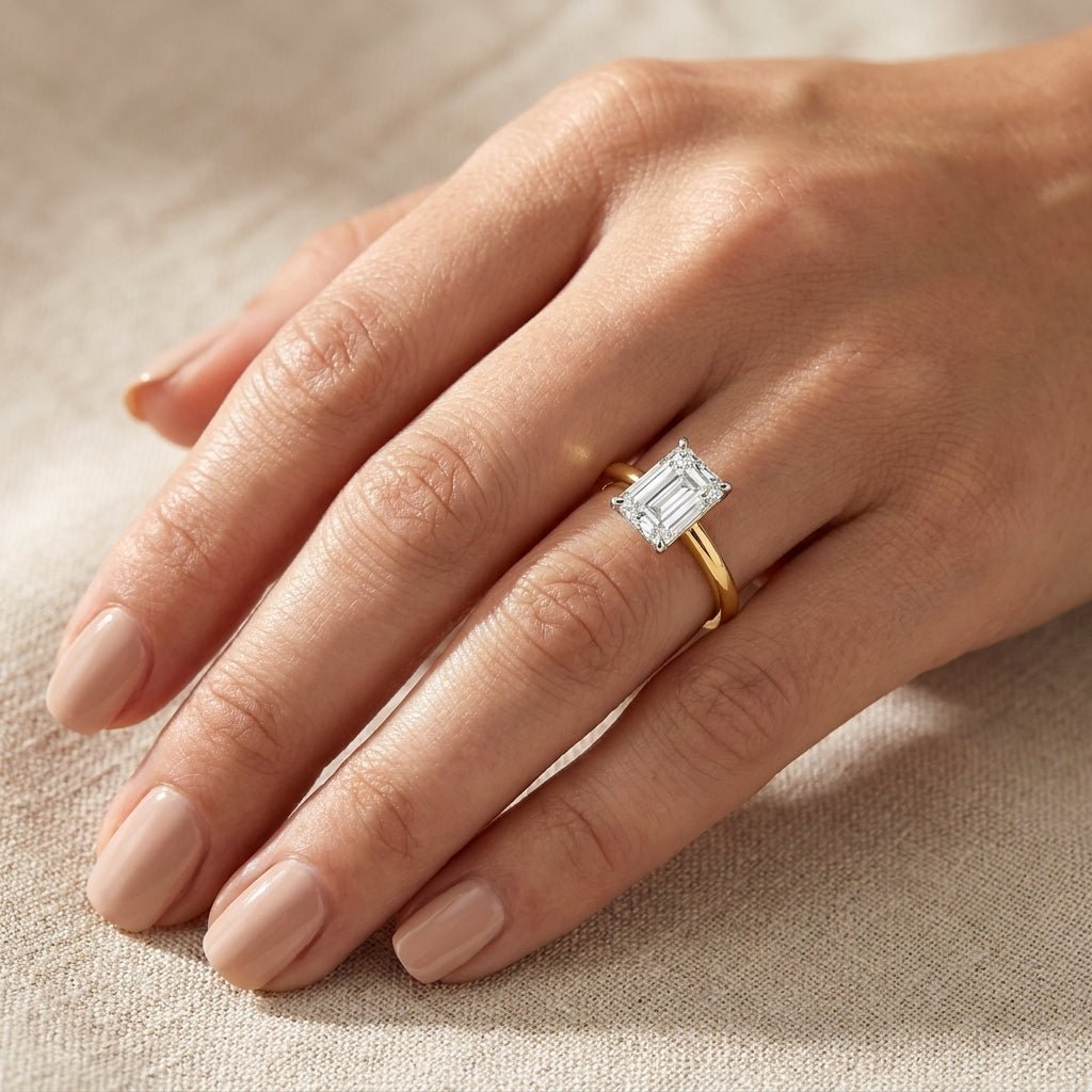SOL-200EM-0LD Emerald solitaire engagement ring hand-model