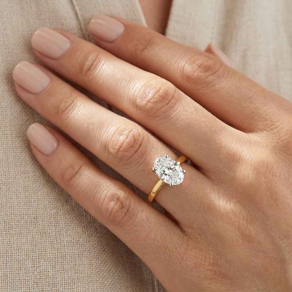 SOL-200O-0LD Oval solitaire engagement ring hand-model