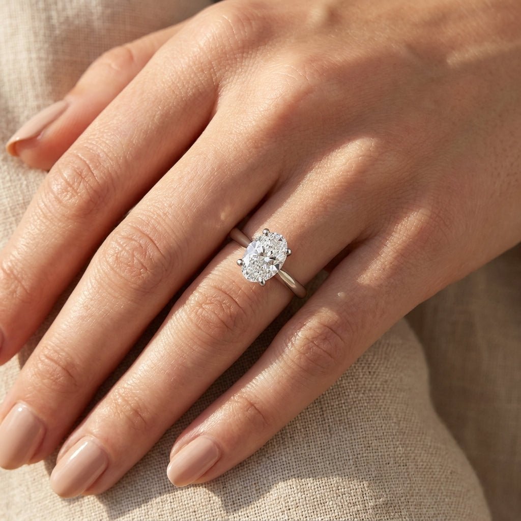 RM12563C-WLD Oval solitaire engagement ring hand-model