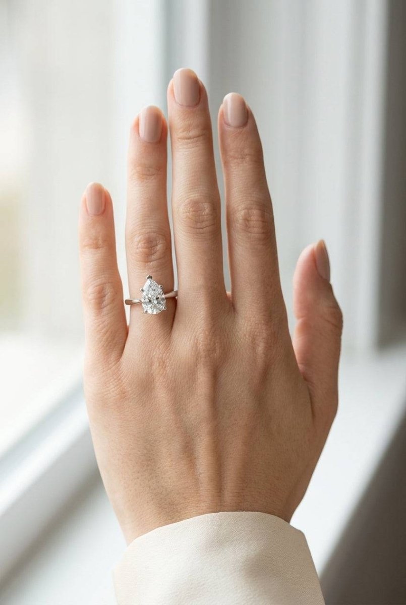 2 carat pear lab grown diamond engagement ring - full hand scale