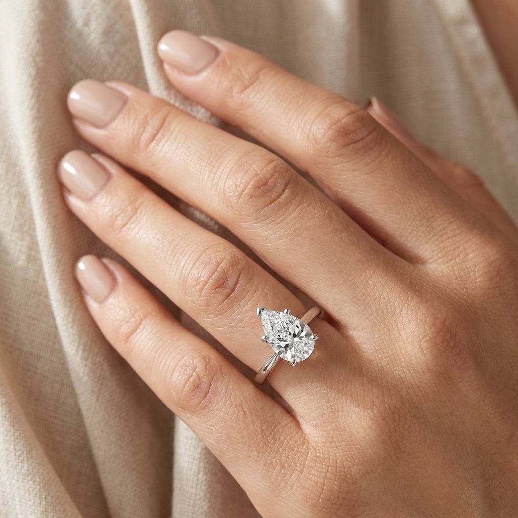 2 carat pear lab grown diamond engagement ring - hand model