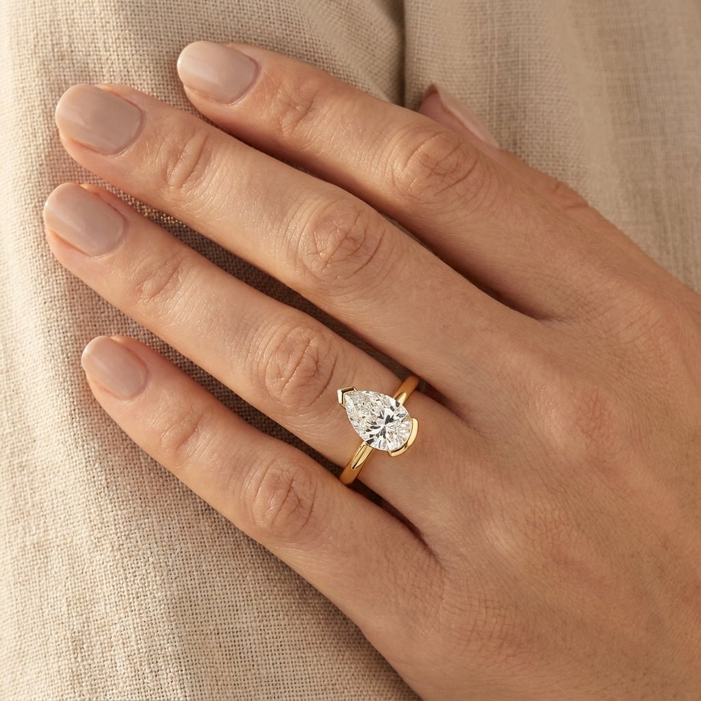 RM12974-200-LD Round solitaire engagement ring hand-model
