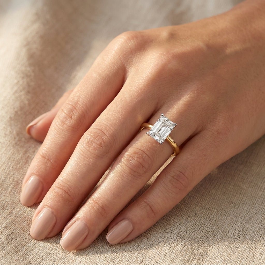 SOL-300EM-0LD Emerald solitaire engagement ring hand-model