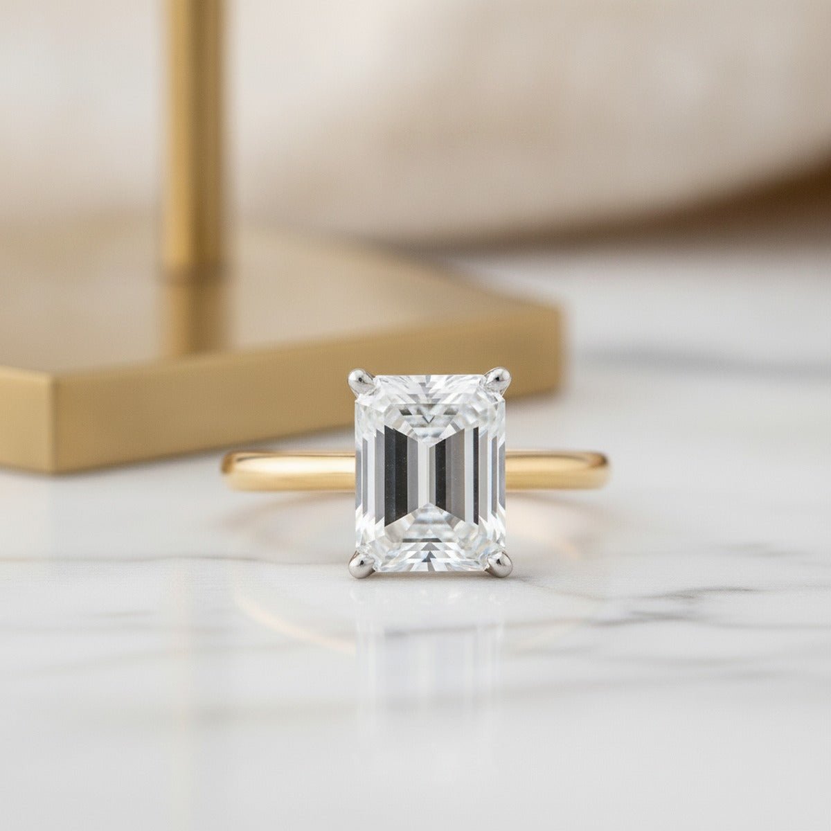 Aydins 3 Carat Emerald Lab Grown Diamond Engagement Ring | 10K Two-Tone Gold lifestyle scene, marble minimal