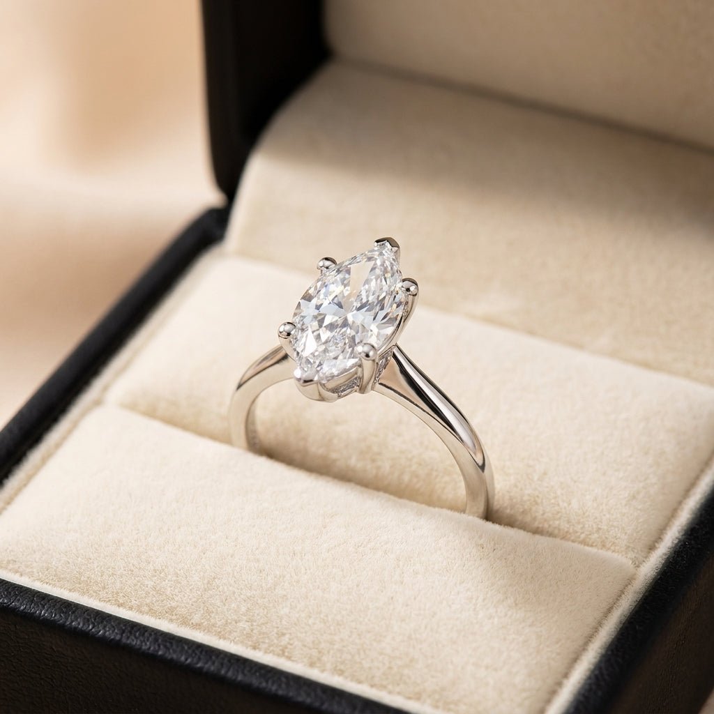 RM12567C-WLD marquise engagement ring in presentation box