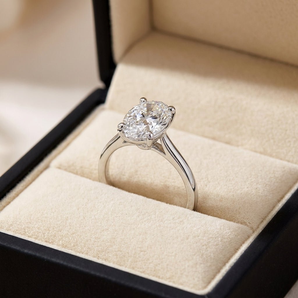 RM12564C-WLD oval engagement ring in presentation box