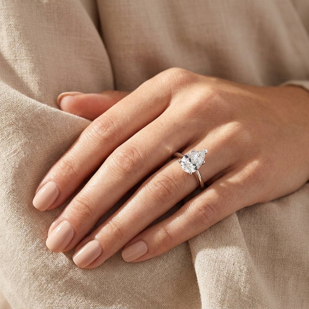 3 carat pear lab grown diamond engagement ring - hand model