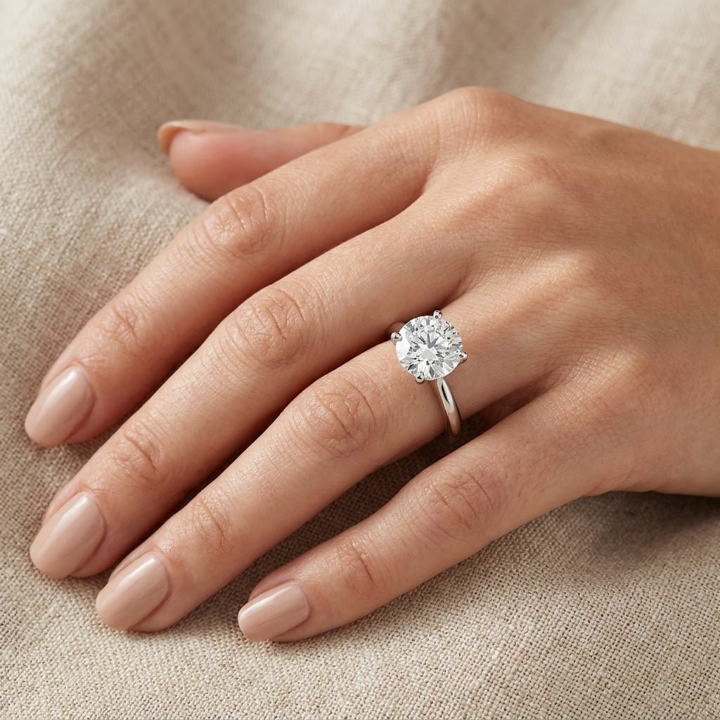 RM12561C-WLD Round solitaire engagement ring hand-model