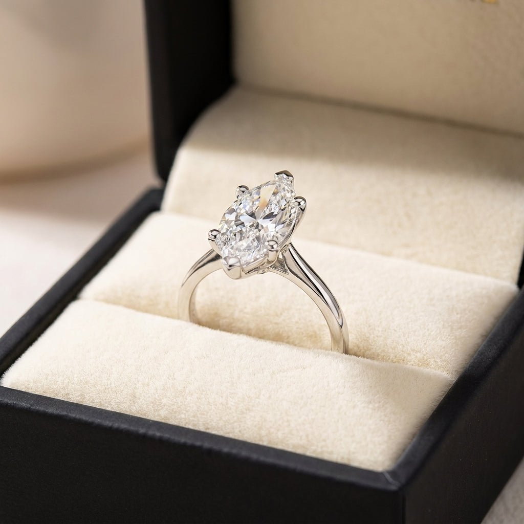 RM12568C-WLD marquise engagement ring in presentation box