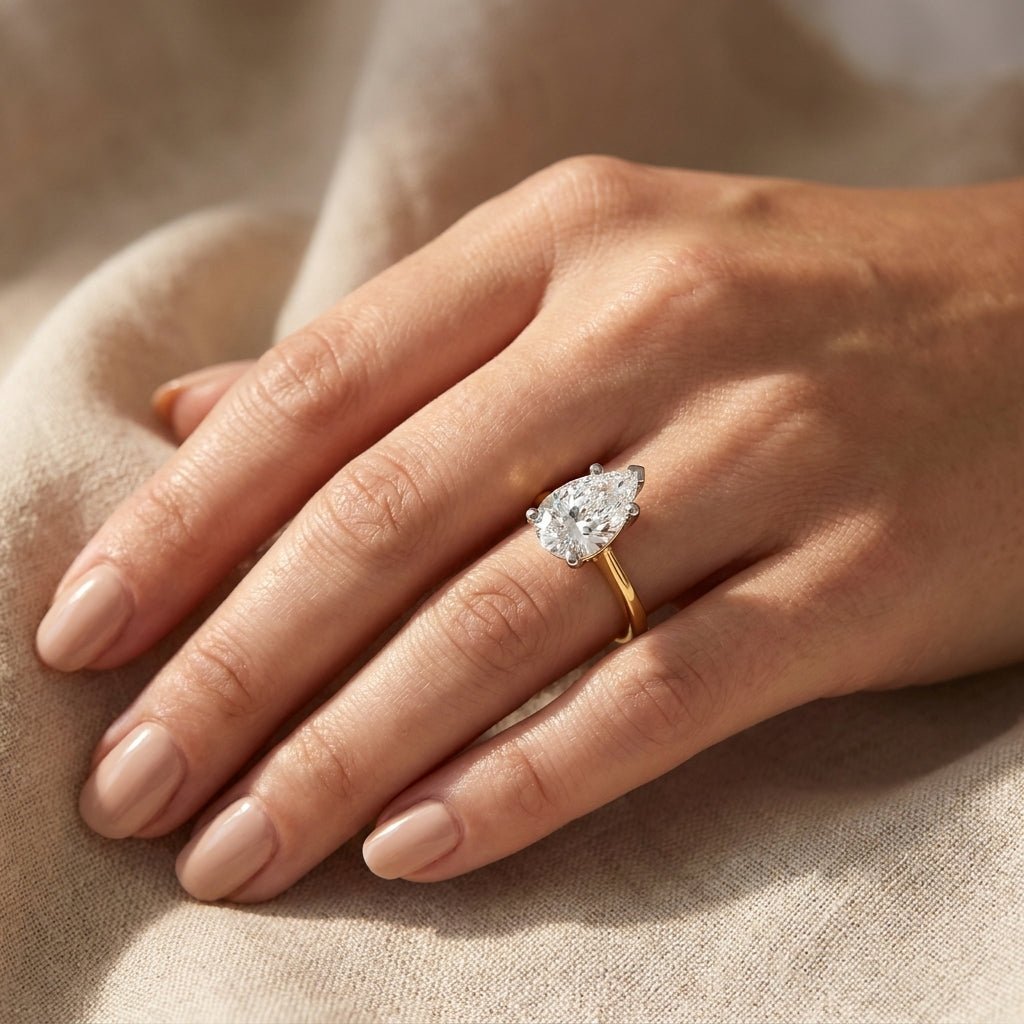 4 carat pear lab grown diamond engagement ring - hand model