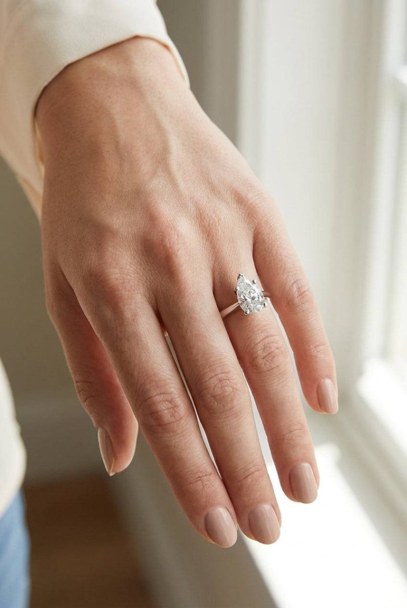 4 carat pear lab grown diamond engagement ring - full hand scale