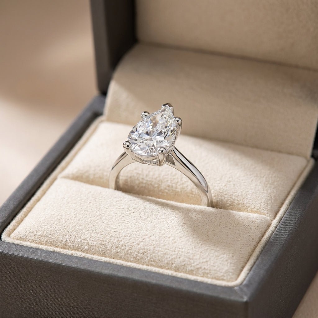 RM12571C-WLD pear engagement ring in presentation box