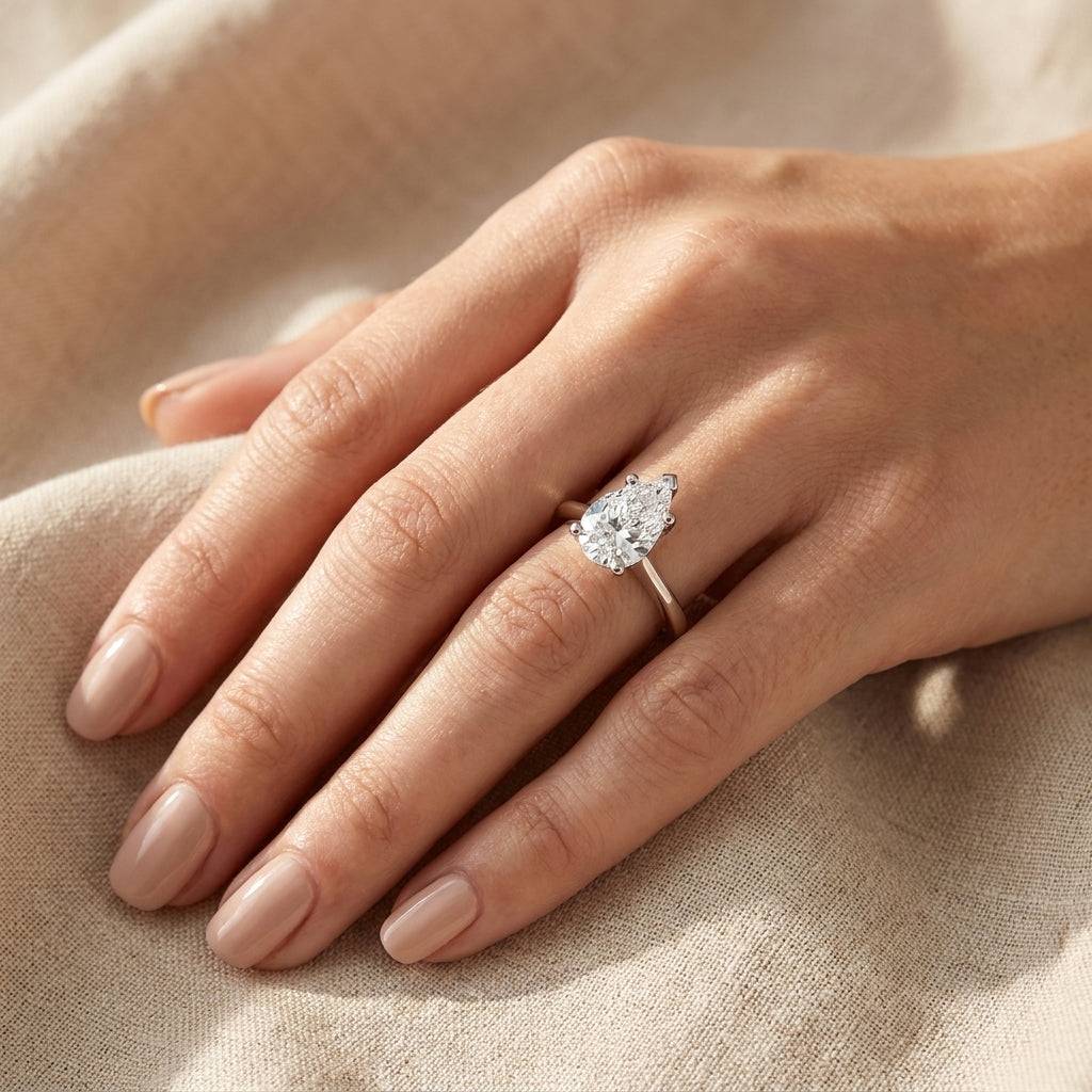 4 carat pear lab grown diamond engagement ring - hand model