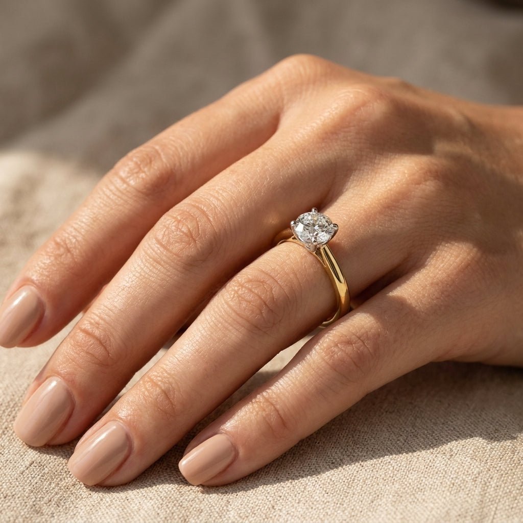 RM12841-400C-LD Round 4-prong solitaire engagement ring hand-model