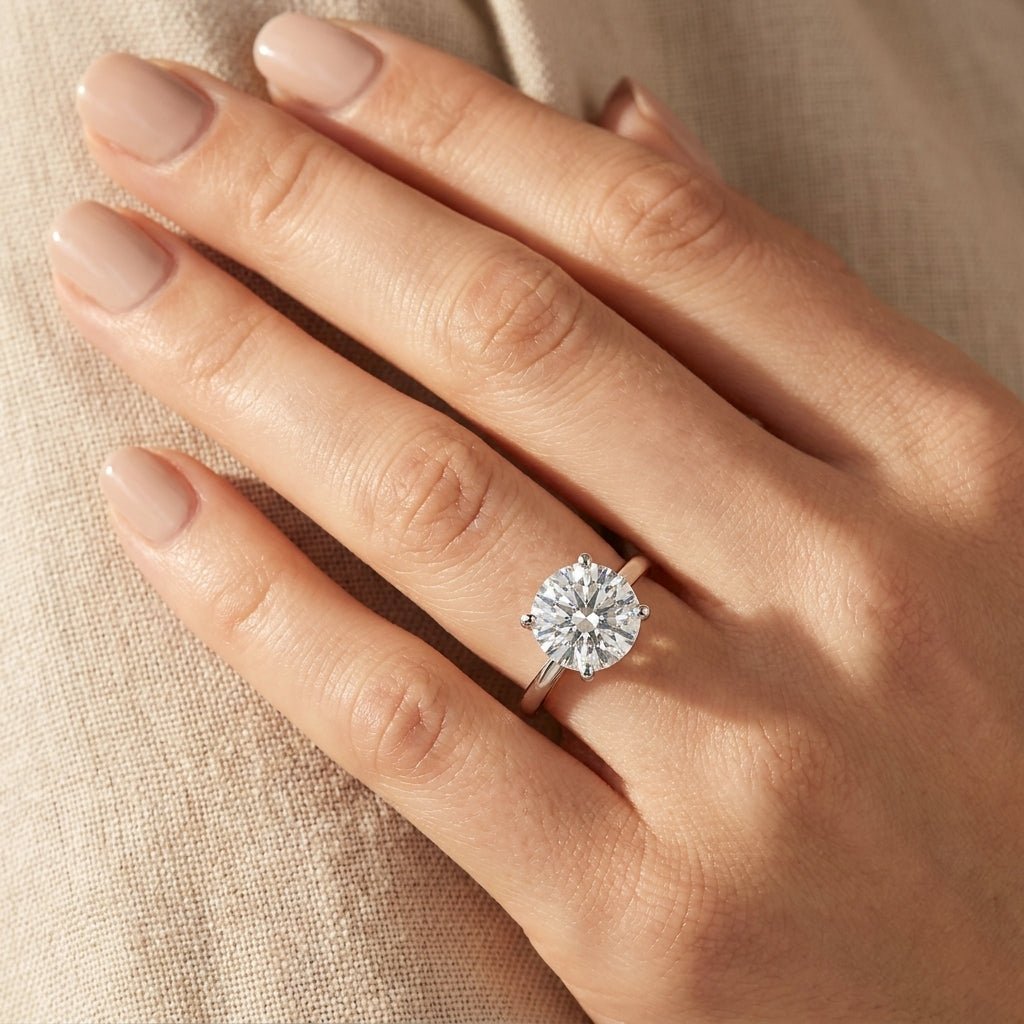 RM12562C-WLD Round solitaire engagement ring hand-model