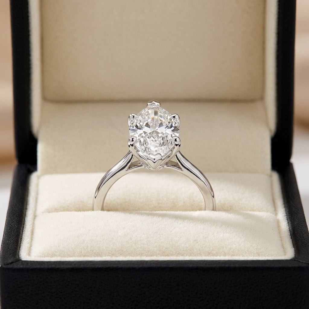 RM12604C-WLD marquise engagement ring in presentation box