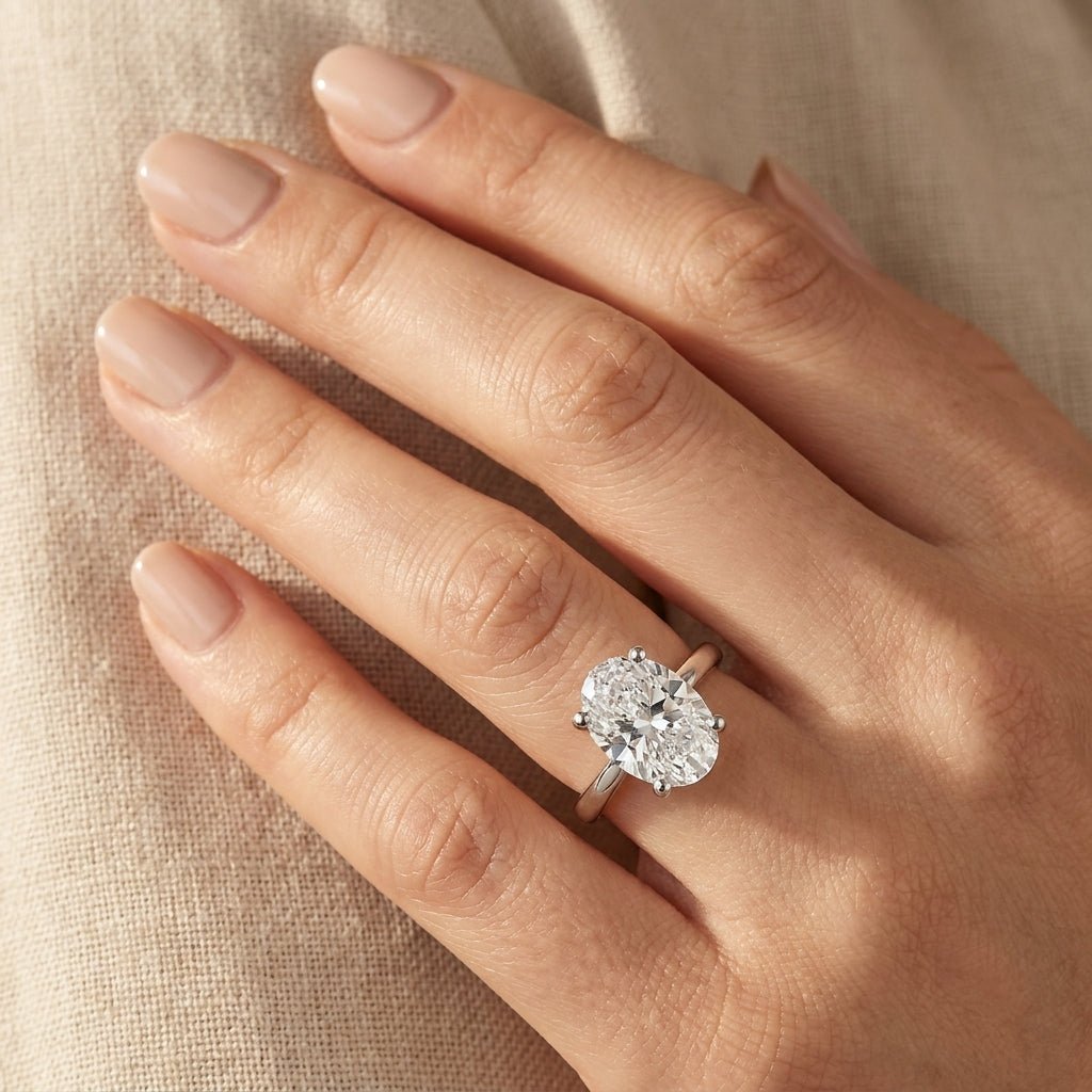 RM12601C-WLD Oval solitaire engagement ring hand-model