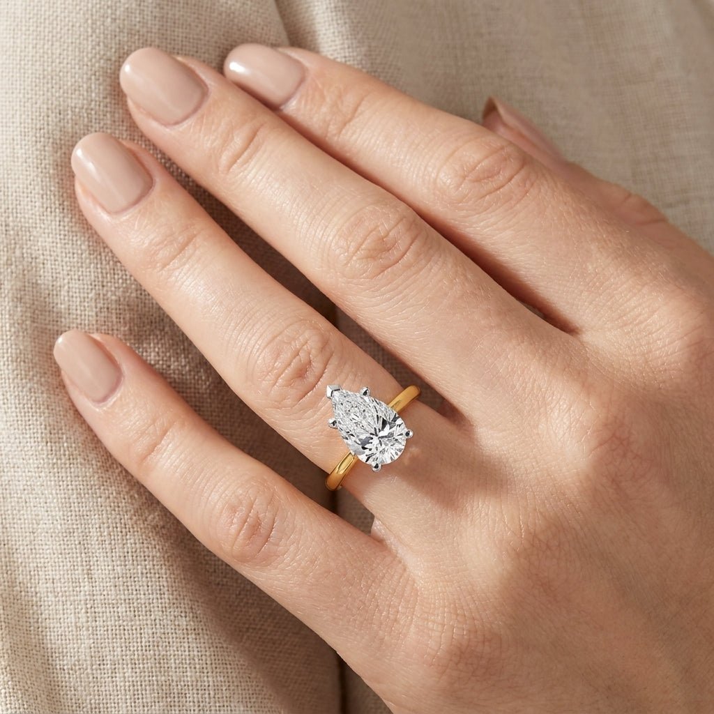 RM12607C-LD Pear 8-prong solitaire engagement ring hand-model
