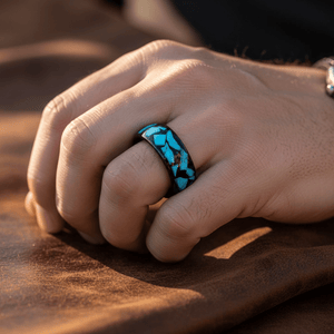 ADONIS — Lifestyle photo on hand — men's tungsten wedding ring.