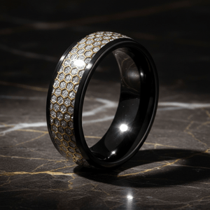 AMANA — Luxury 3/4 angle on dark marble — men's tungsten wedding ring.