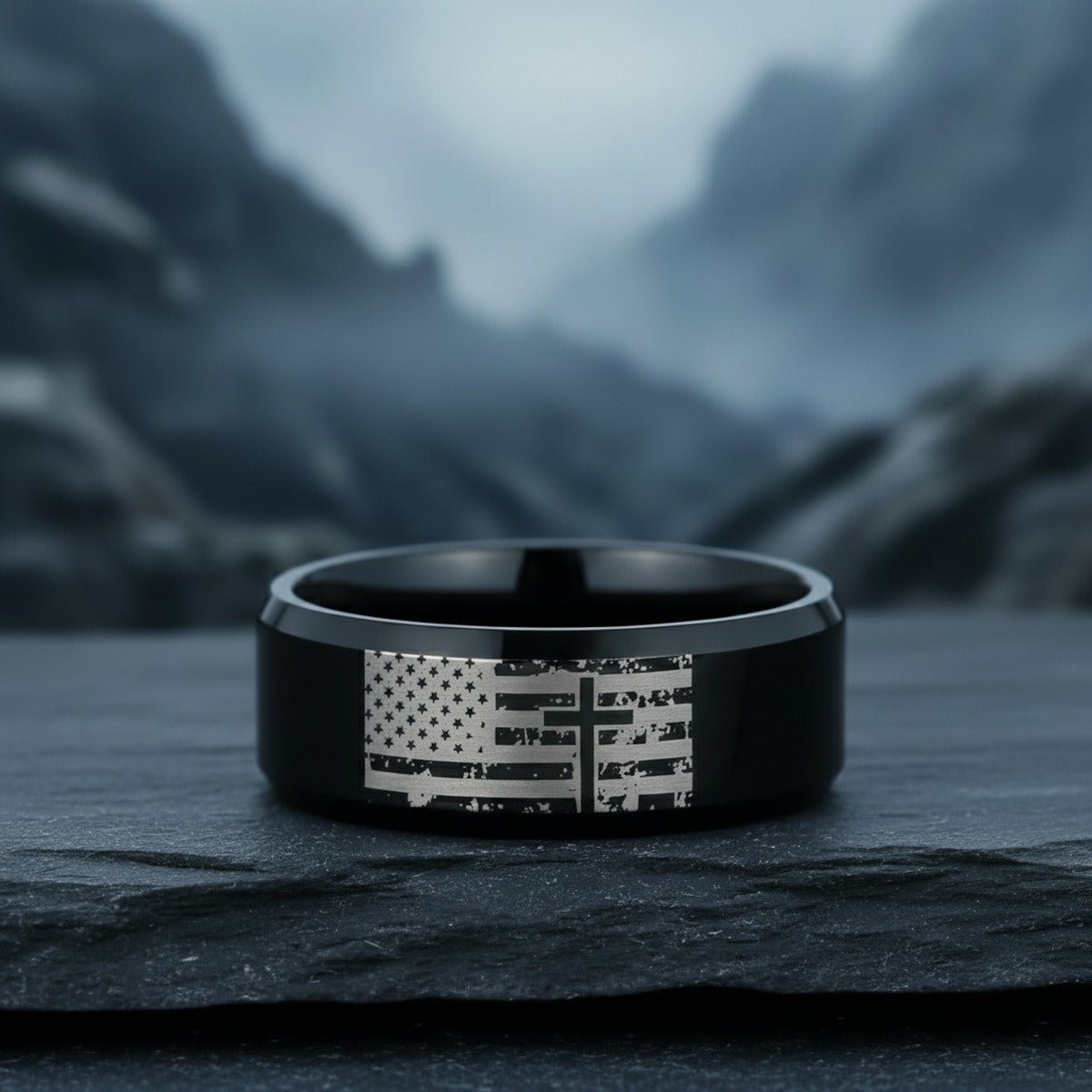 Aydins AMERICAN FLAG & CROSS | Engraved Black Tungsten Band, Beveled lifestyle scene, slate stone mountain