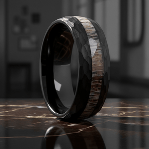 ANTLOR — Luxury 3/4 angle on dark marble — men's tungsten wedding ring.
