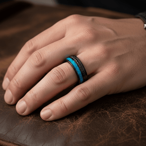 AQUORION — Lifestyle photo on hand — men's tungsten wedding ring.