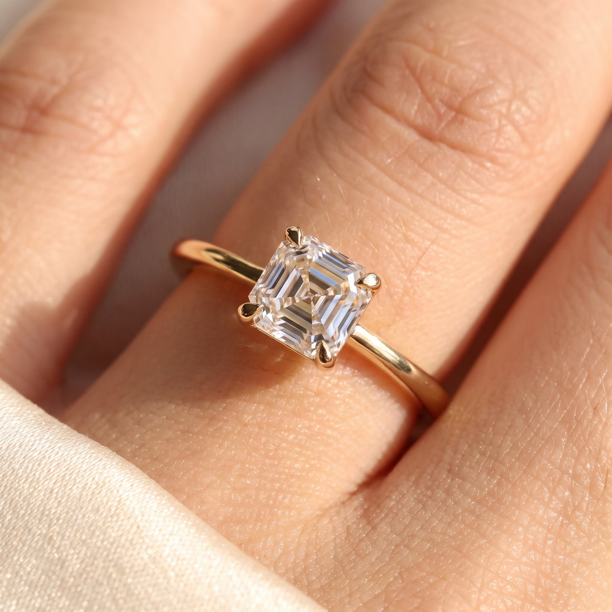 Asscher lab-grown diamond solitaire engagement ring, Yellow Gold, on-finger close-up