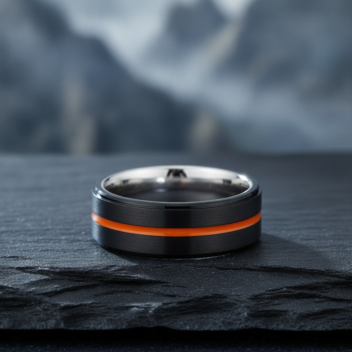 Aydins AUGUSTA | Silver Ring, Black Tungsten Ring, Orange Groove, Stepped Edge lifestyle scene, slate stone mountain