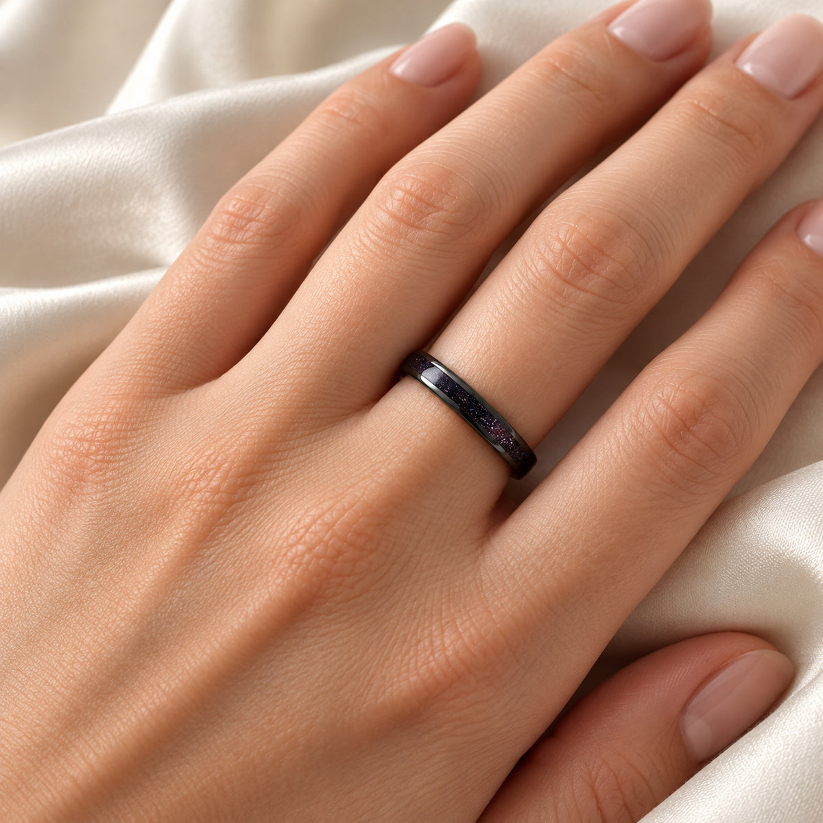 ASTRUM black tungsten band with purple goldstone, on hand