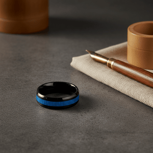 BAMBOOZLE — Editorial masculine still life — men's tungsten wedding ring.