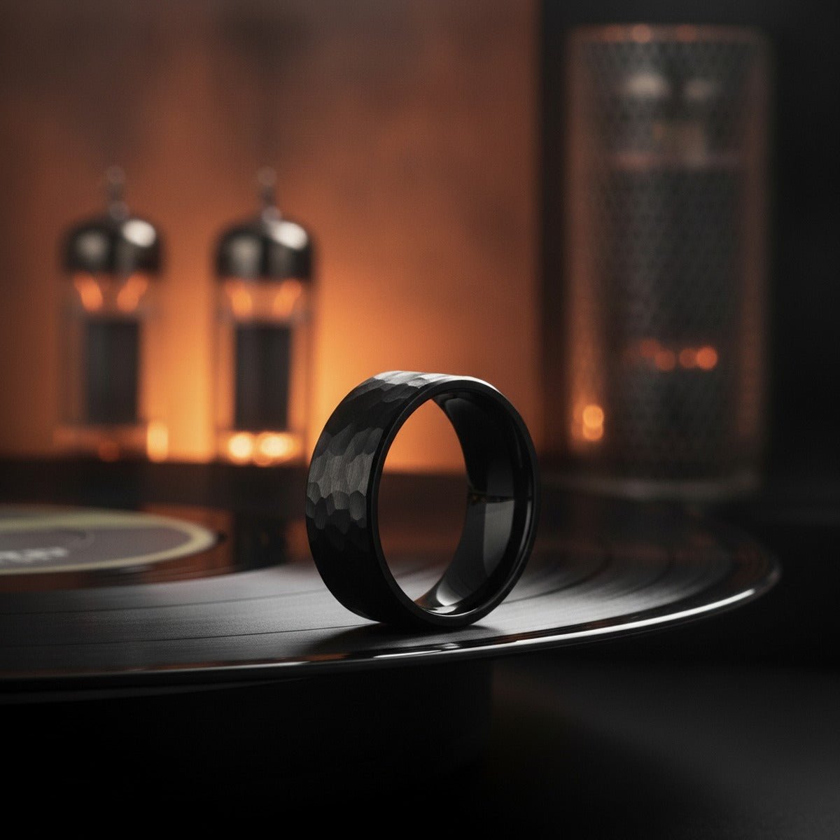 Aydins BANDIT | Black Ring, Black Tungsten Ring, Hammered, Flat lifestyle scene, vinyl record amp